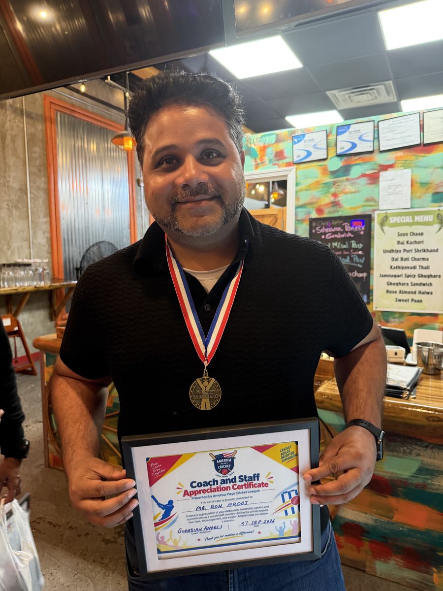 Mr. Ron Arooj holding his Coach and Staff Appreciation Certificate